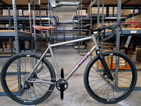 #1588NS – Titanium All-Road | Purple Logo / Drop Bars / Rival eTap / 700x38c (Size Large, Used-Very Good Condition)