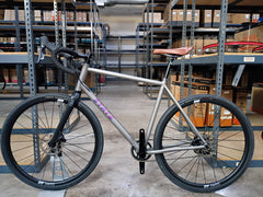 #1588NS – Titanium All-Road | Purple Logo / Drop Bars / Rival eTap / 700x38c (Size Large, Used-Very Good Condition)