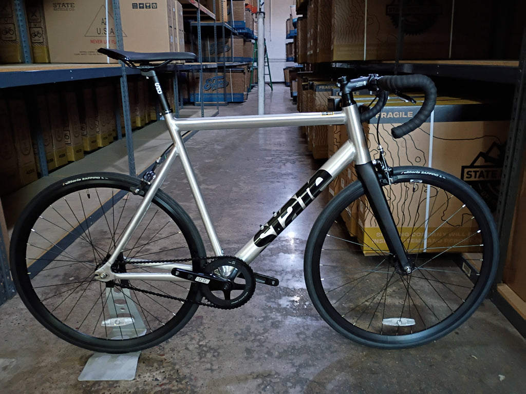 #1675 – 6061 Black Label V3 | Raw / Black / Drop Bars (Size 61cm, Very Good / Unridden)