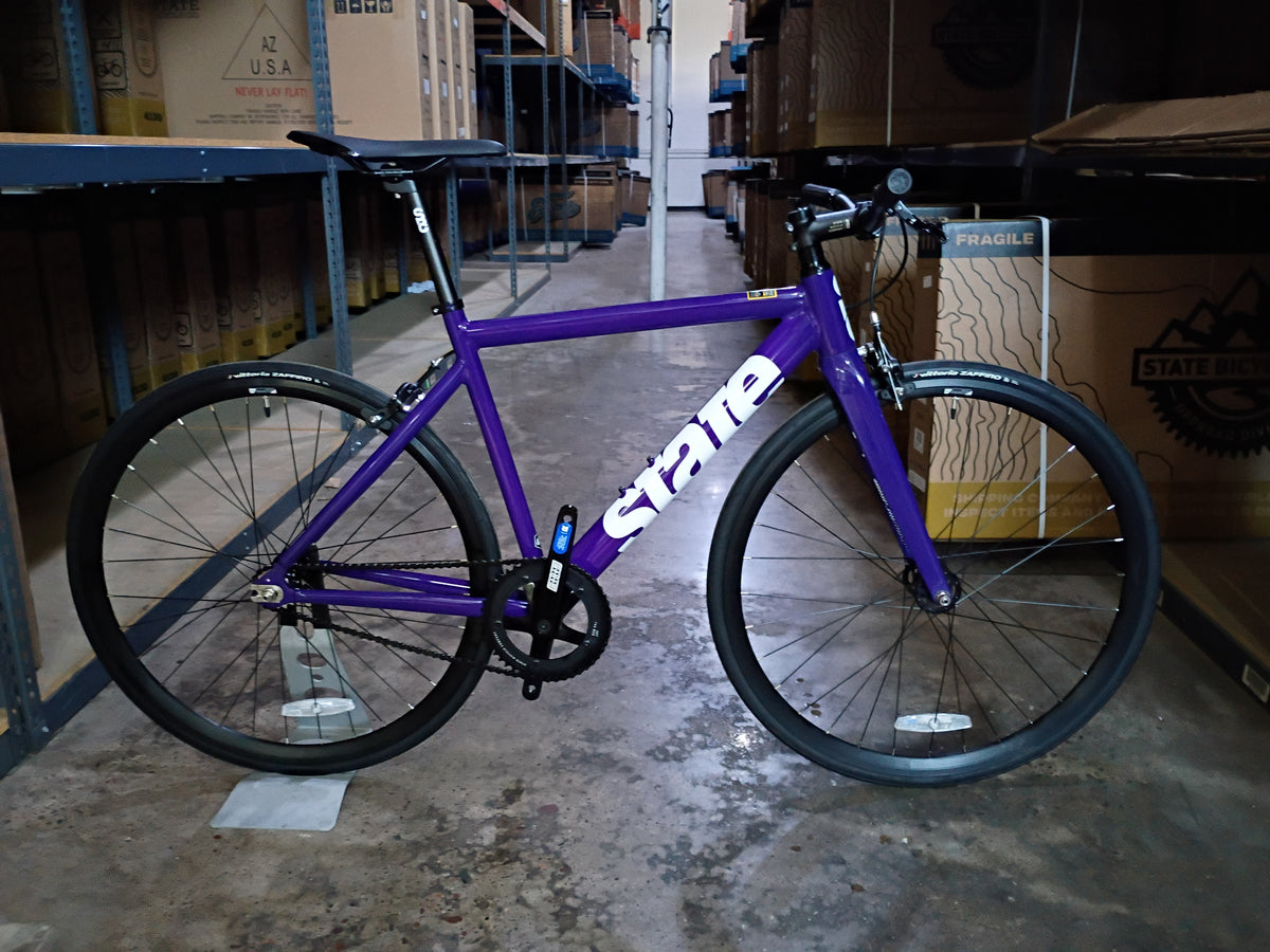 #1701 – 6061 Black Label V3 | Purple & White / Riser Bars / 700c (Size 49cm, Brand New / Open Box)
